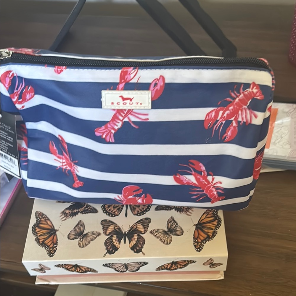 Scout Lobster Print Striped Pouch with goodies inside